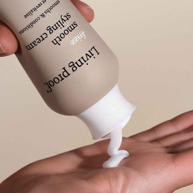 Living Proof styling cream applied to hair to reduce frizz and add shine