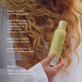 Living Proof bottle in beach setting conveying fresh summer scent benefit