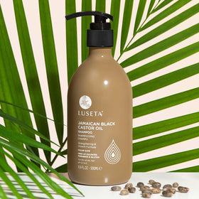 L LUSETA shampoo in hand during shower illustrating effective cleansing benefit