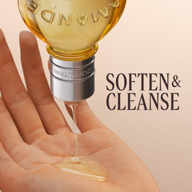 L'OCCITANE pouring oil texture on hand showing silky emollient and easy spread