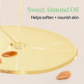 7 oz L'OCCITANE Almond refill beside a hand for scale to show generous quantity