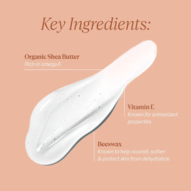 L'OCCITANE lip balm held in hand to show compact travel-friendly size