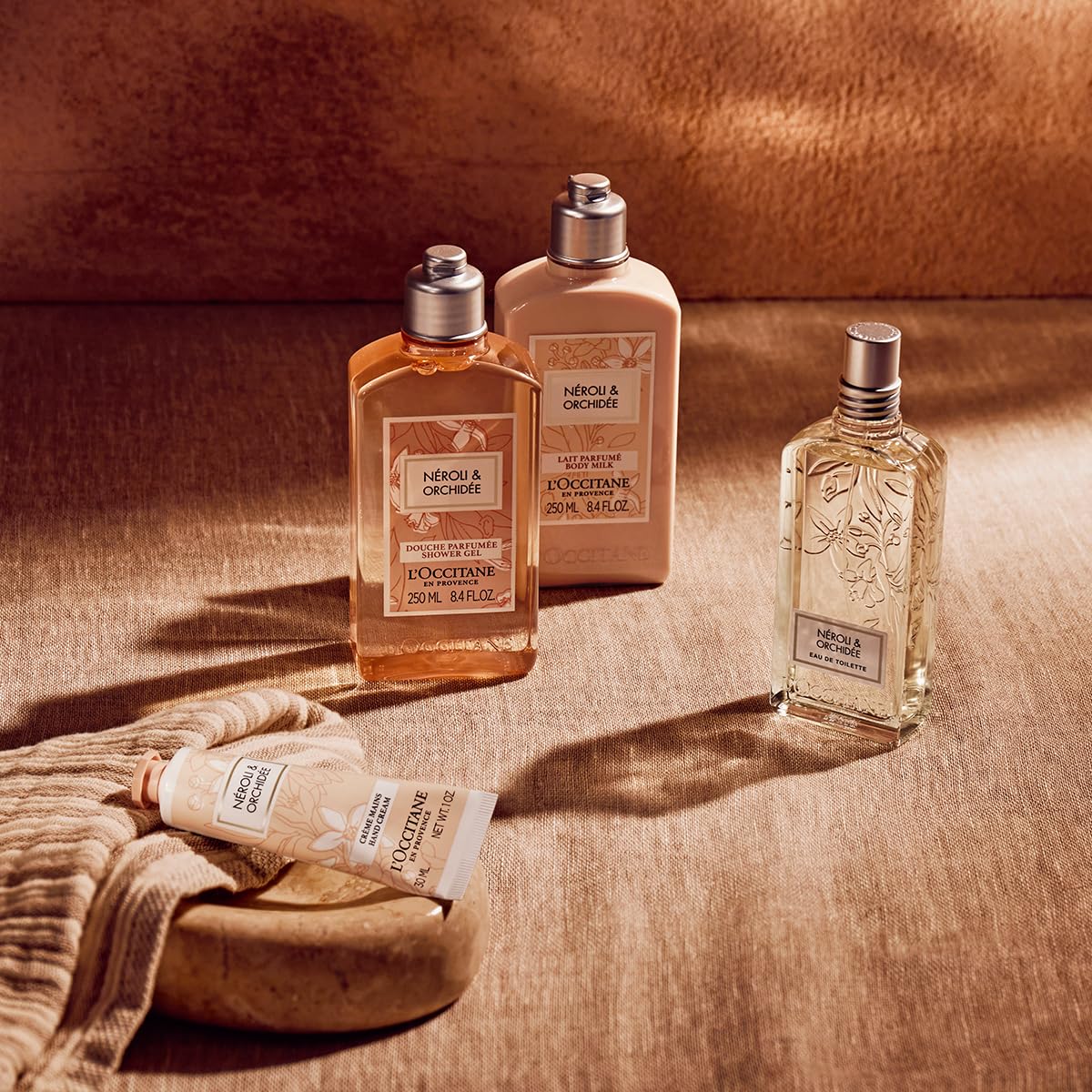 L'OCCITANE shower scene with bottle in a stylish bathroom showing a luxurious experience