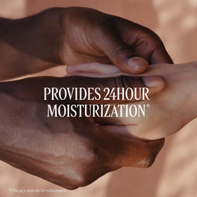 L'OCCITANE being applied to hands showing softened skin benefit