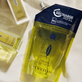 L'Occitane refill pouch spout being opened for easy pouring