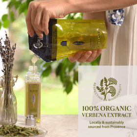 L'Occitane refill held in hand to show 16.90 fl. oz size and scale