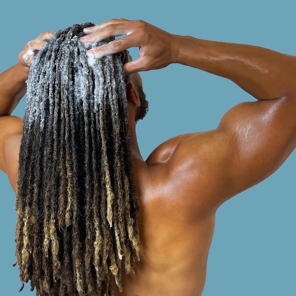 LOCssentials being applied to locs in shower for deep-cleaning and refresh