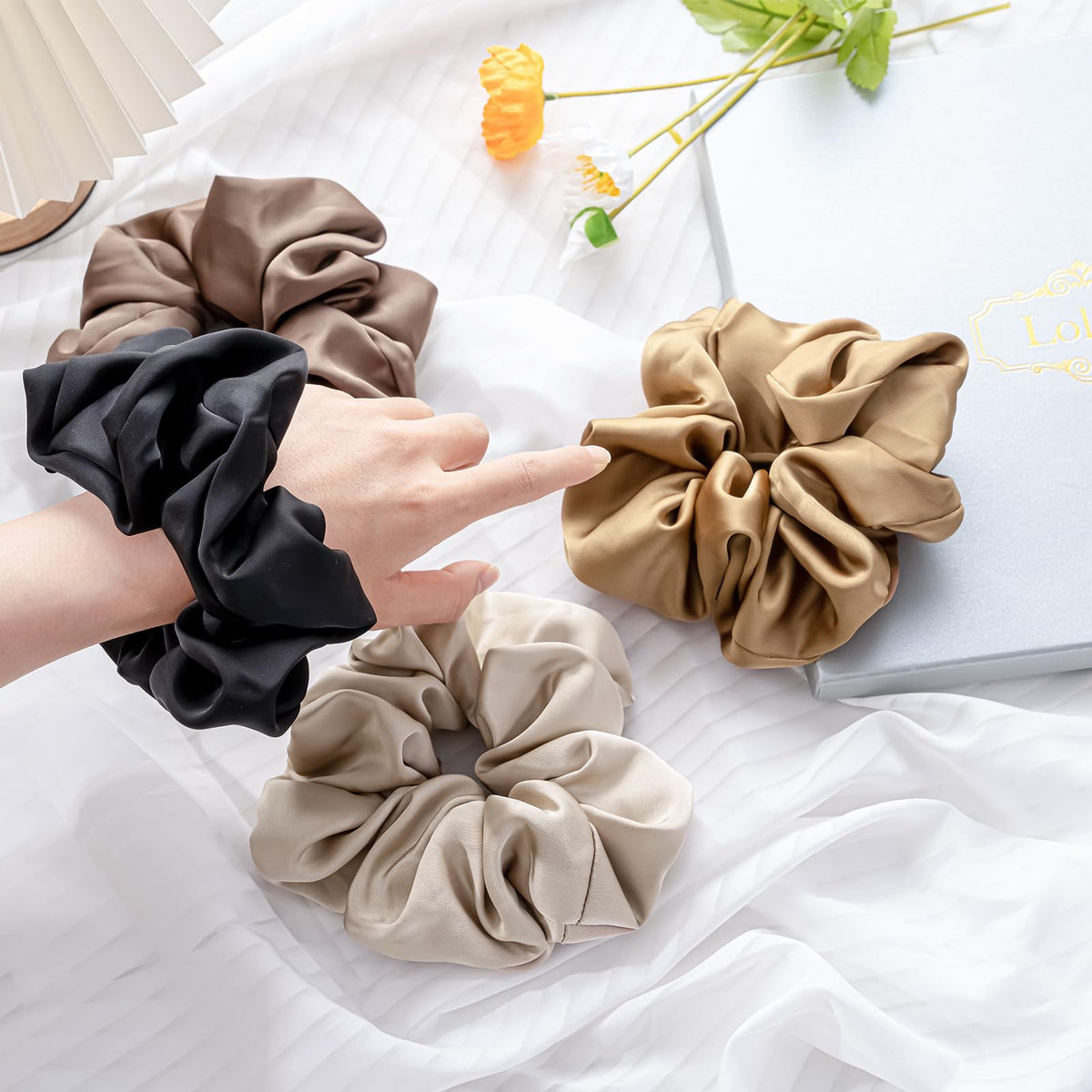 Lolalet scrunchie beside a ruler showing 5.9-inch diameter scale and fit