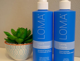 Loma leave-in conditioner in hand to show 8 oz size and travel-friendly convenience