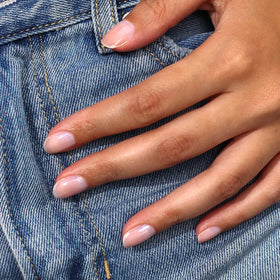 LONDONTOWN Gel Genius top coat glossy finish on nail showing long-wear benefit
