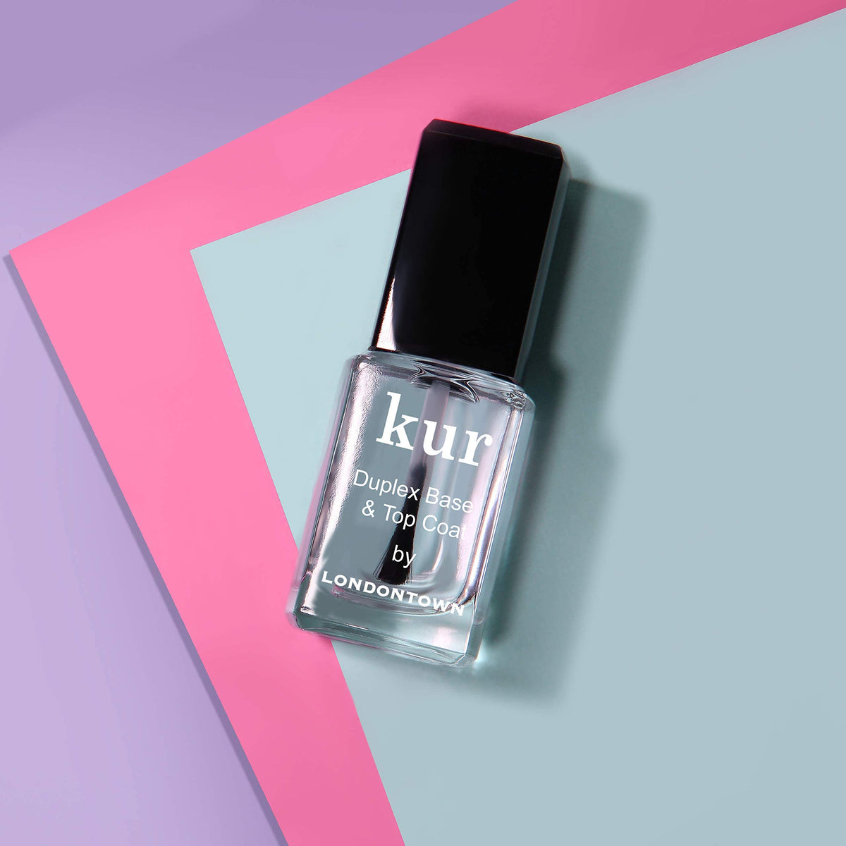 LONDONTOWN kur Duplex applied on nails during a manicure demonstrating long-lasting shine