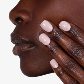 LONDONTOWN manicured hands using product for longer-lasting polish appearance