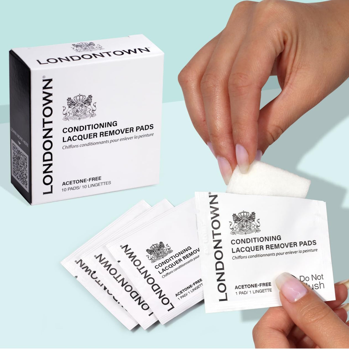 LONDONTOWN pad wiping colored polish from nail showing quick, clean removal