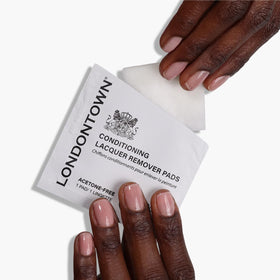 LONDONTOWN individually wrapped pad tucked inside a purse for travel convenience