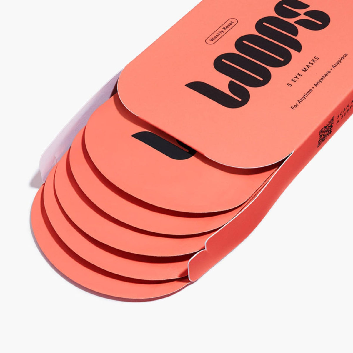 LOOPS eye mask held in hand to show size and application ease