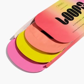LOOPS package beside a coin to show compact travel size benefit