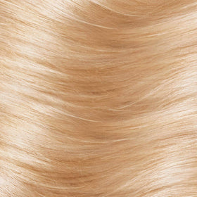 L'Oreal Paris kit contents laid out with colorant, developer and conditioning balm