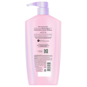 L'Oreal Paris bottle on bathroom shelf in lifestyle setting suggesting everyday luxury