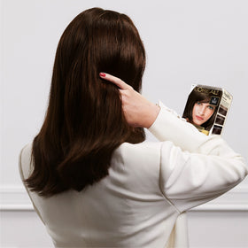 L'Oreal Paris after-color results on model, displays cool ultra light ash brown