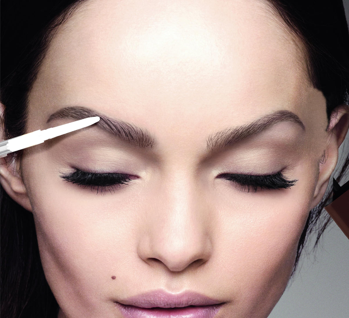 L'Oreal Paris pencil in a travel kit on bathroom counter demonstrating convenience