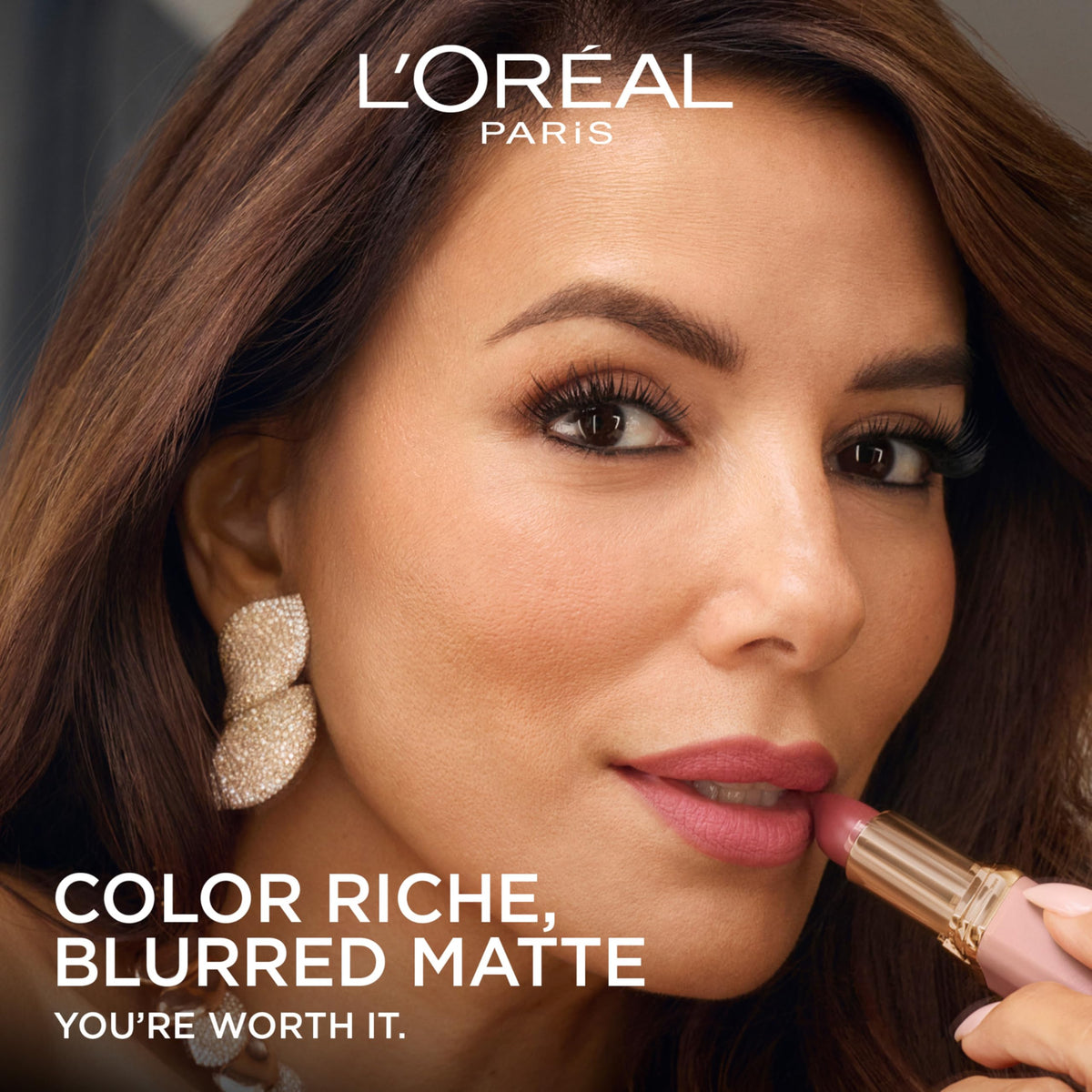 L'Oreal Paris product with argan oil droplets highlighting nourishing ingredient benefits