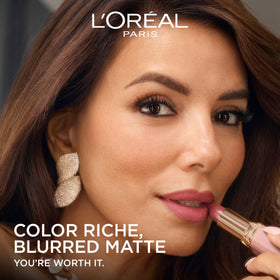 L'Oreal Paris product with argan oil droplets highlighting nourishing ingredient benefits