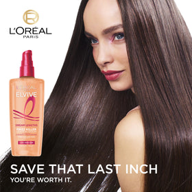 L'Oreal Paris 3.4 oz bottle beside ruler showing compact size for travel