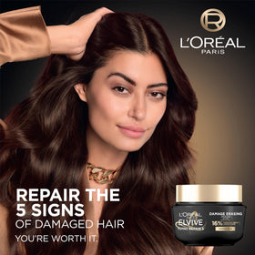 L'Oreal Paris Elvive balm being applied to mid-lengths for easier detangling