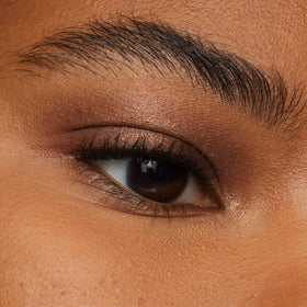 L'Oreal Paris swatch of Brown Abyss on arm showing rich pigment and blendability benefit