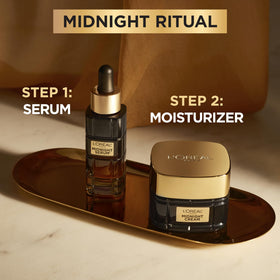 L'Oreal Paris cream in hands showing 1.7oz scale and travel-friendly size