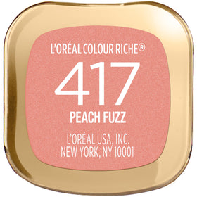 L'Oreal Paris lipstick beside a hand to show Peach Fuzz scale and travel-friendly size