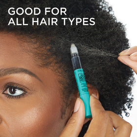 L'Oreal Paris pen next to travel items showing compact size for on-the-go touch-ups