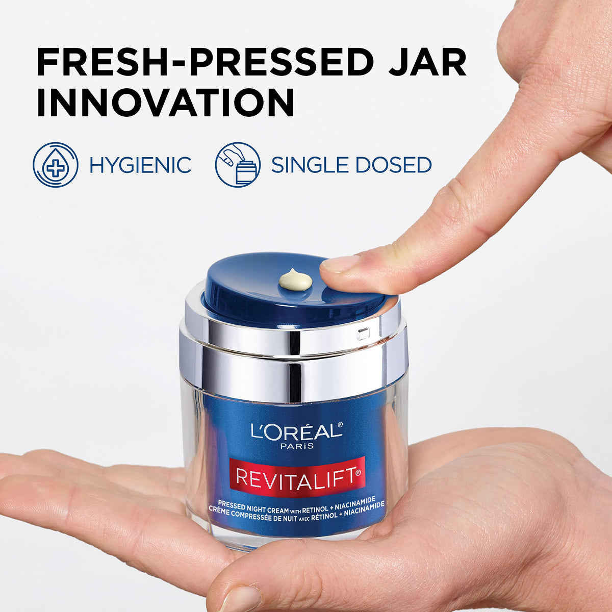 L'Oreal Paris applying cream to the back of hand to show non-greasy finish