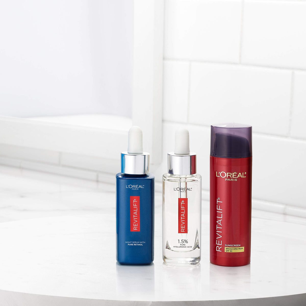 L'Oreal Paris Revitalift next to a ruler showing compact 1.7 oz travel-friendly size