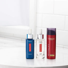 L'Oreal Paris Revitalift next to a ruler showing compact 1.7 oz travel-friendly size