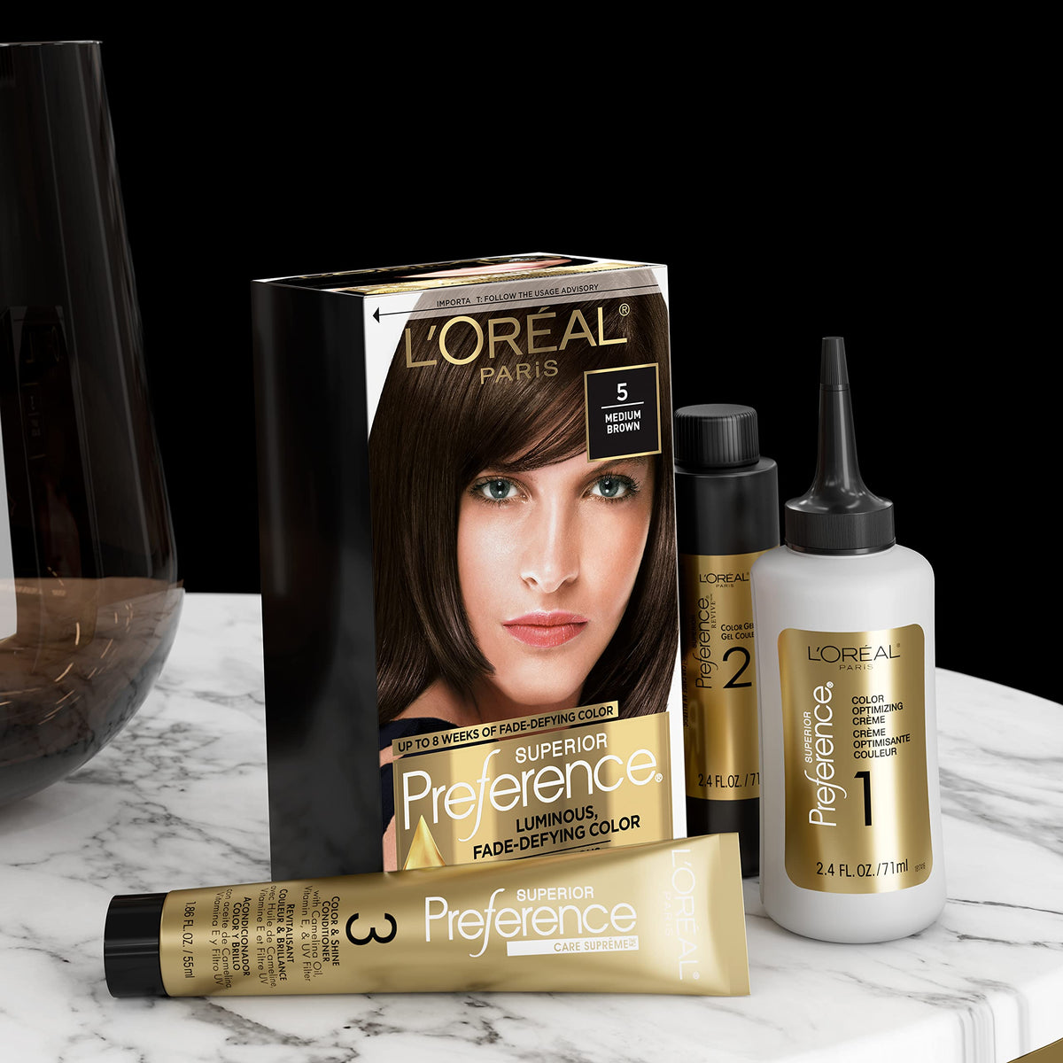 L'Oreal Paris scale comparison with hand holding box showing package size and portability