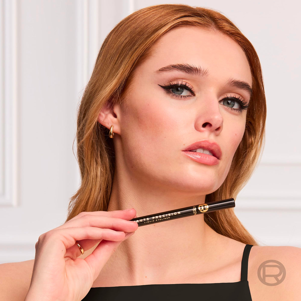 L'Oreal Paris eyeliner beside ruler to show compact size and travel-ready convenience
