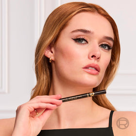 L'Oreal Paris eyeliner beside ruler to show compact size and travel-ready convenience