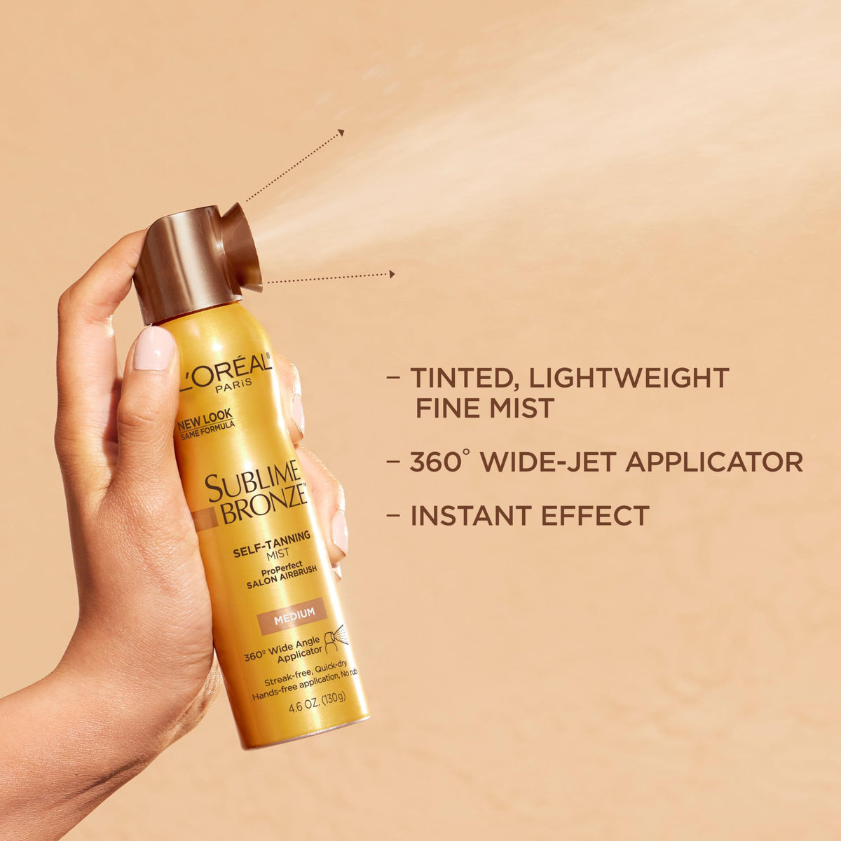 L'Oreal Paris lifestyle image of tan on skin in beach robe for natural-looking result