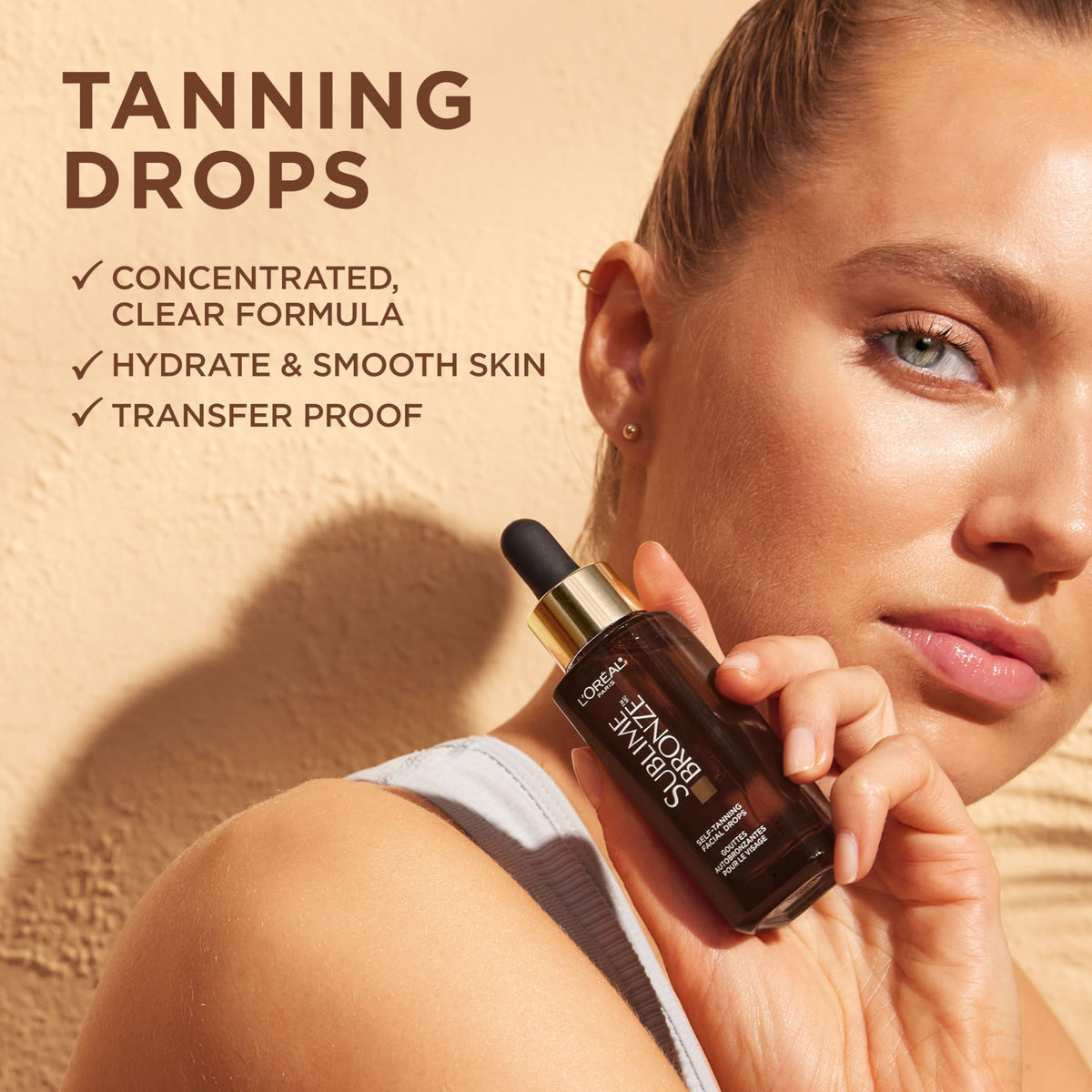 L'Oreal Paris drops mixed into moisturizer demonstrating easy application