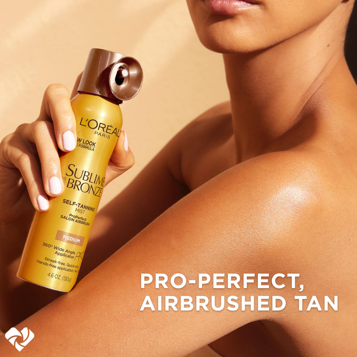 L'Oreal Paris mist sprayed on forearm illustrating smooth, streak-free coverage