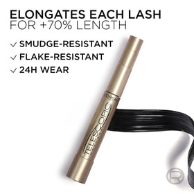 L'Oreal Paris telescopic in hand for scale showing compact travel-friendly size