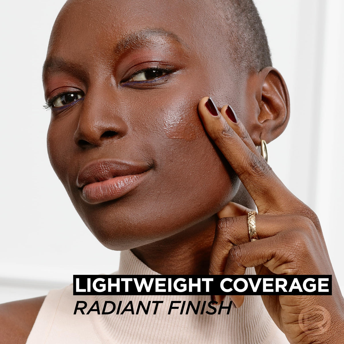 L'Oreal Paris lifestyle shot in bathroom showing everyday radiant makeup routine benefit