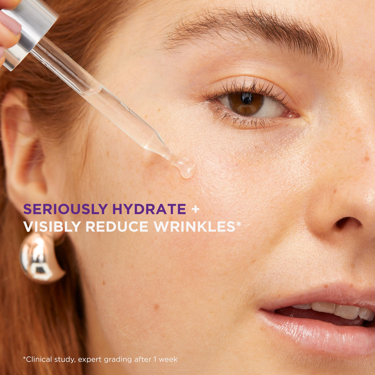 Applying L'Oreal Paris Revitalift serum to cheek showing instant dewy hydration