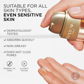 L'Oreal Paris gold-finish bottle detail emphasizing premium design and daily indulgence