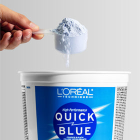 L'OREAL TECHNIQUE stylist mixing bleach and developer for controlled lift