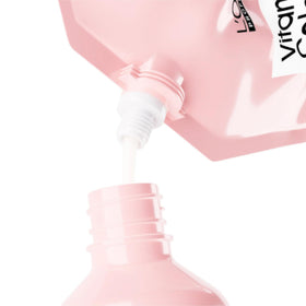 L'Oréal Professionnel refill held in hand showing 16.91 fl oz scale