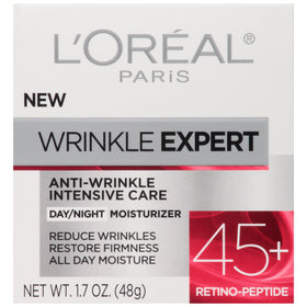 L'Oreal Paris jar held in hand for scale, illustrates compact 1.7 fl oz travel-friendly size