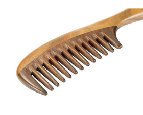 Louise Maelys comb next to label and packaging showing natural material and product information