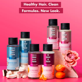 Love Beauty and Planet bottle on bathroom vanity with rose for uplifting scent
